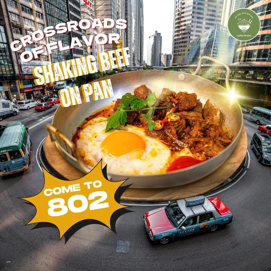 Social post — shaking beef in wok composited onto aerial city roundabout with "Come to 802" CTA